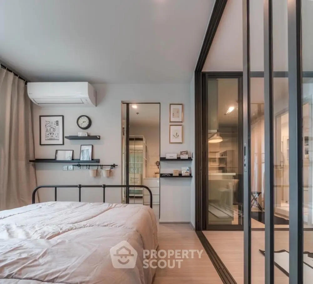 Modern bedroom with sliding glass doors and stylish decor