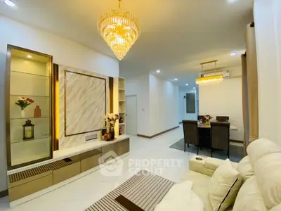 Luxurious living room with elegant chandelier and modern decor