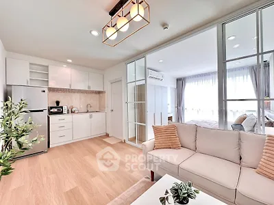 Modern open-plan living room and kitchen with elegant decor and natural light