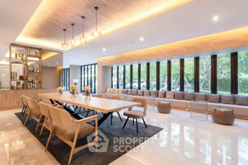 Luxurious modern living room with elegant dining area and large windows offering natural light.