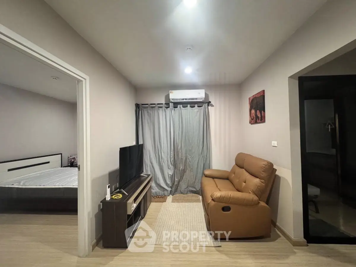 Cozy living room with modern furniture and natural light, perfect for relaxation and entertainment.