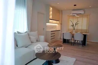 Modern living room with elegant dining area and stylish furniture