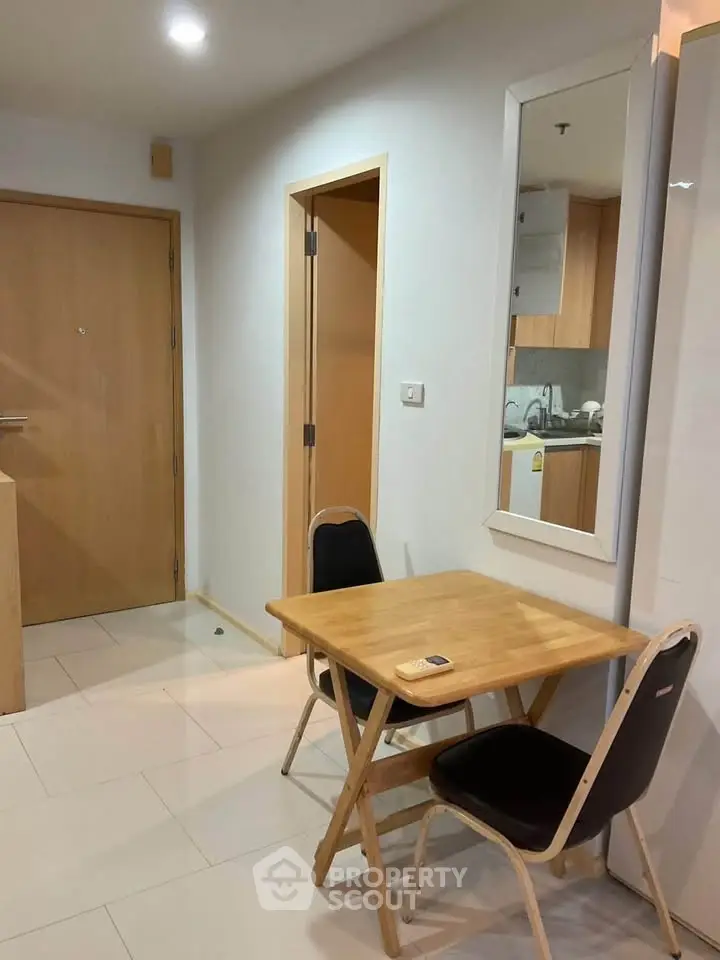 Cozy dining nook with wooden table and chairs in modern apartment