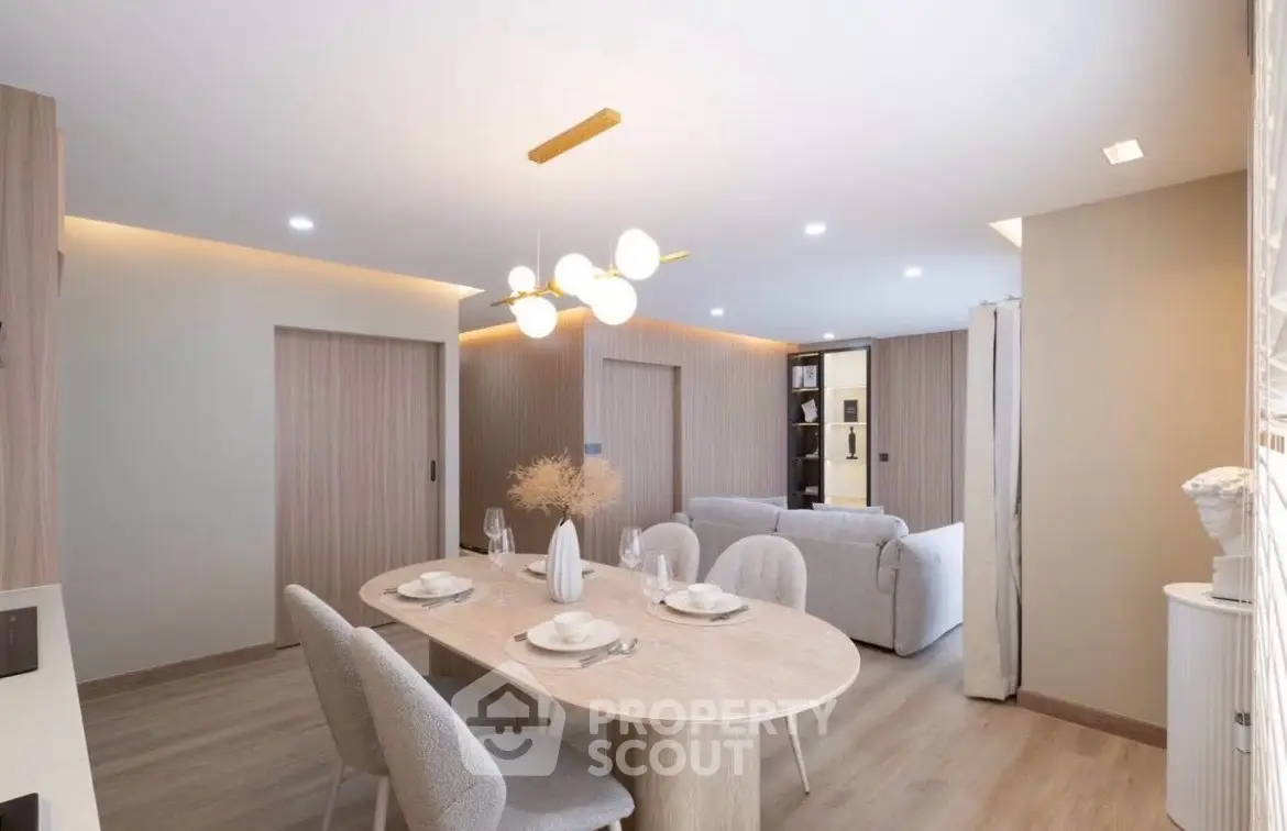 Modern living room with elegant dining area and stylish lighting