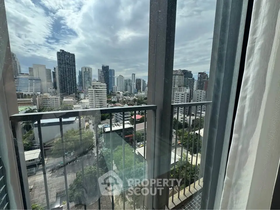 Stunning cityscape view from a modern high-rise balcony, perfect for urban living enthusiasts.