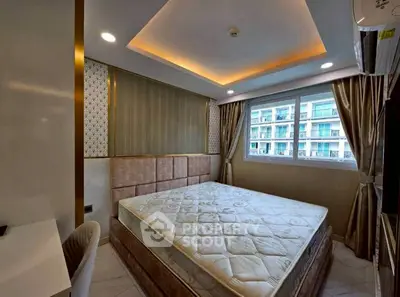 Luxurious bedroom with elegant design and large window offering city view