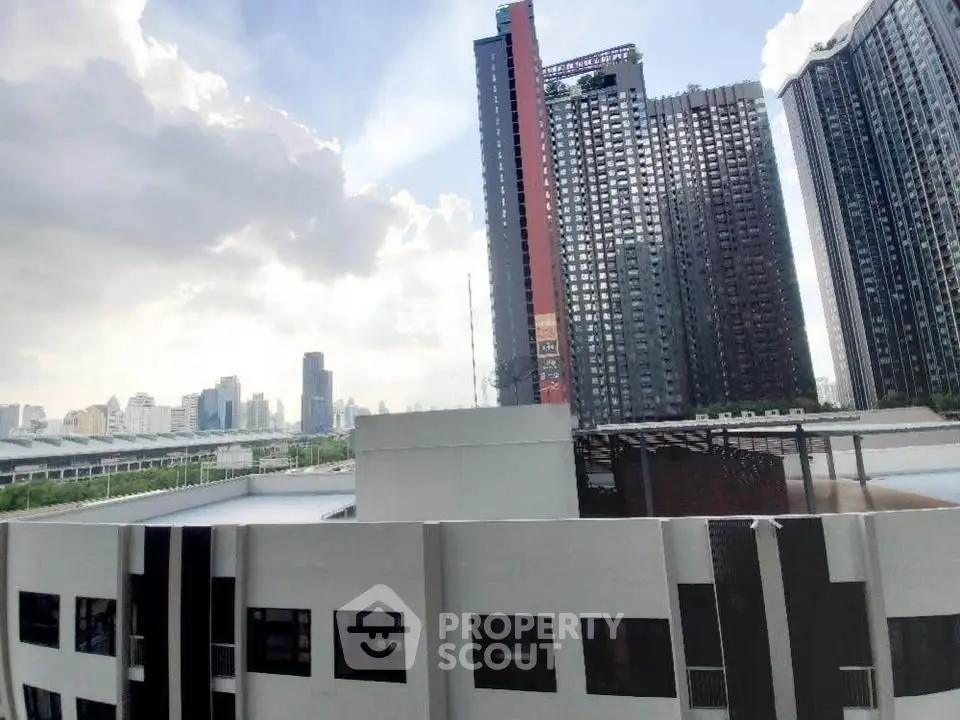 Stunning cityscape view from modern high-rise apartment balcony