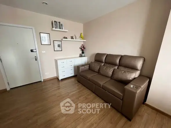 Cozy living room with brown leather sofa and modern decor