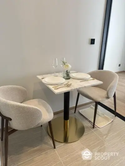 Modern dining nook with elegant table setting in contemporary apartment