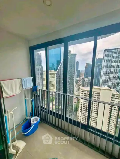 High-rise apartment balcony with stunning city skyline view, perfect for urban living.