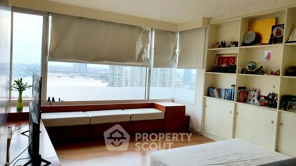 Spacious bedroom with stunning city view and built-in shelves
