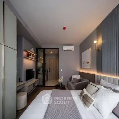 Modern bedroom with stylish decor and cozy ambiance in a contemporary apartment.