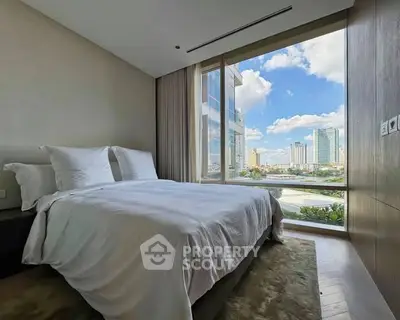 Luxurious bedroom with stunning city view and modern decor