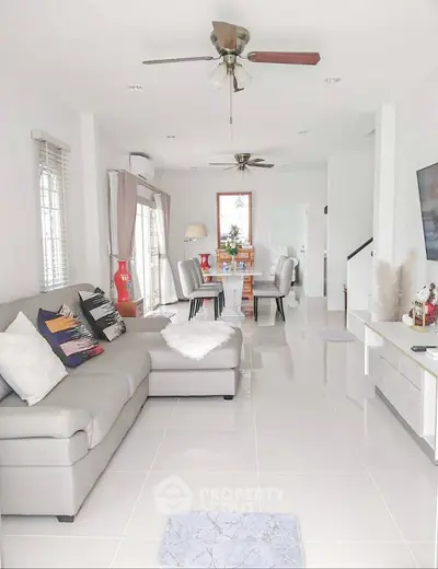Spacious modern living room with elegant decor and ample natural light