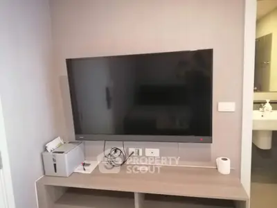 Modern living room with wall-mounted TV and sleek console table