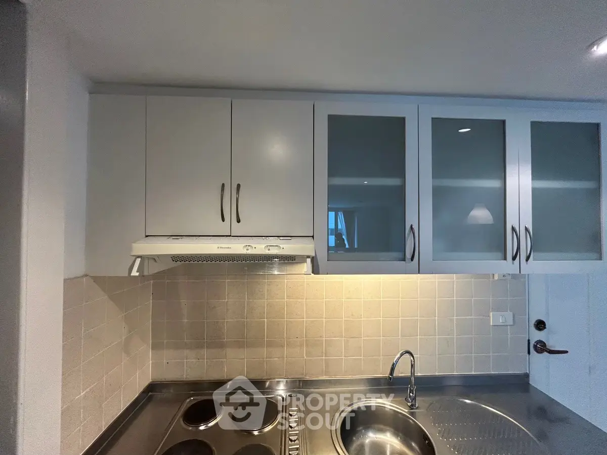 Modern kitchen with sleek cabinets and stainless steel appliances