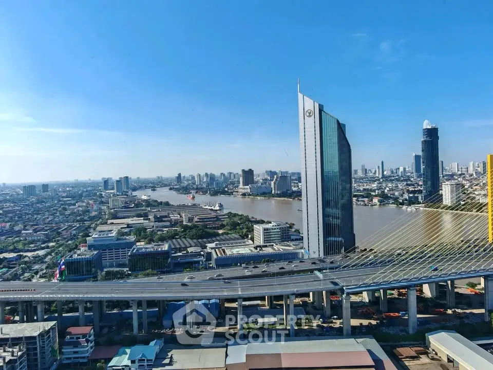 Stunning cityscape view with modern skyscrapers and river, showcasing urban living at its finest.
