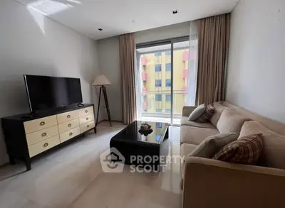 Modern living room with stylish furniture and large window view