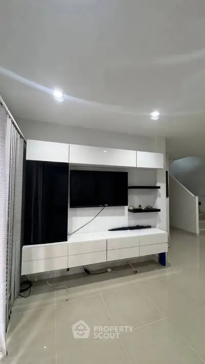Modern living room with sleek entertainment unit and minimalist design