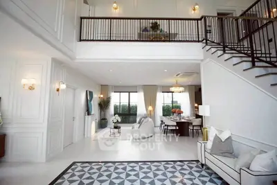 Luxurious open-plan living room with high ceilings and elegant decor