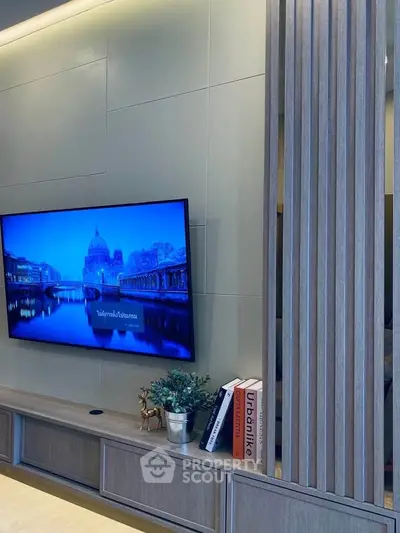 Modern living room with wall-mounted TV and stylish decor