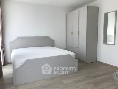 Spacious modern bedroom with elegant furniture and minimalist design