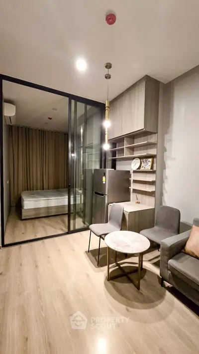 Modern living room with open layout and stylish furniture in a cozy apartment.