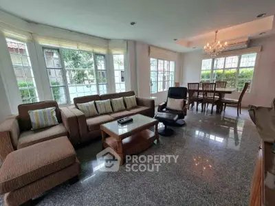 Spacious living room with elegant furniture and large windows in a modern home