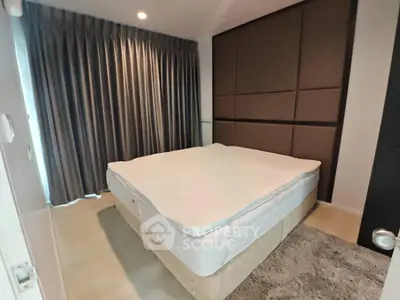 Modern bedroom with stylish panel wall and cozy ambiance