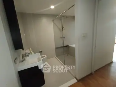 Modern bathroom with glass shower and sleek fixtures