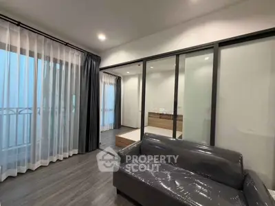 Modern living room with sleek design and large windows