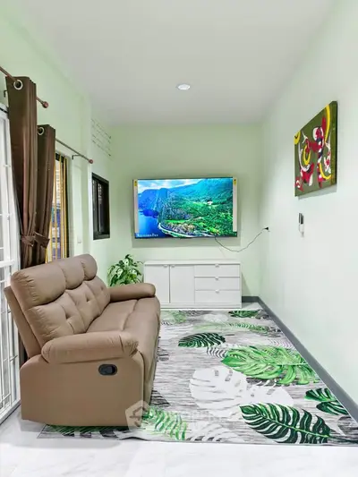 Stylish living room with modern decor, featuring a plush sofa, wall-mounted TV, and vibrant artwork.