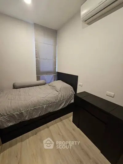 Cozy bedroom with modern decor and air conditioning unit