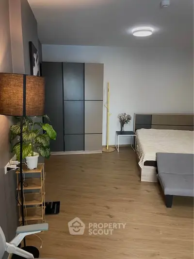Modern bedroom with sleek wardrobe and cozy lighting