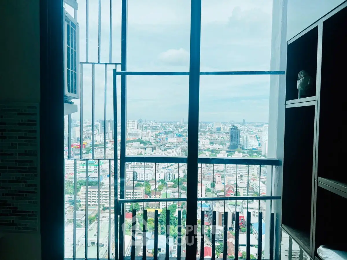 Stunning cityscape view from high-rise apartment window with modern shelving.