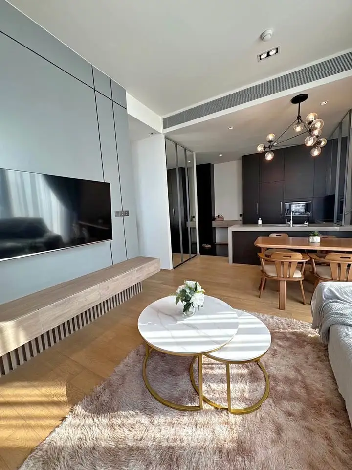 Modern open-plan living room with sleek kitchen and stylish decor