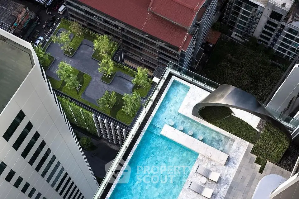 Stunning rooftop pool with cityscape view and lush greenery in luxury high-rise building.