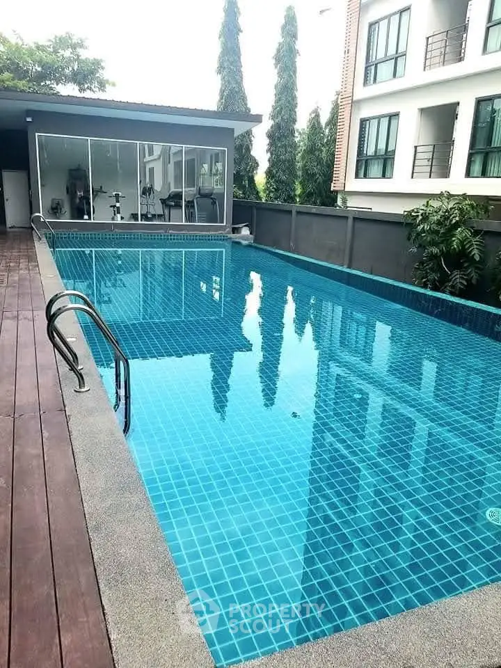 Luxurious residential pool area with modern design and serene ambiance.