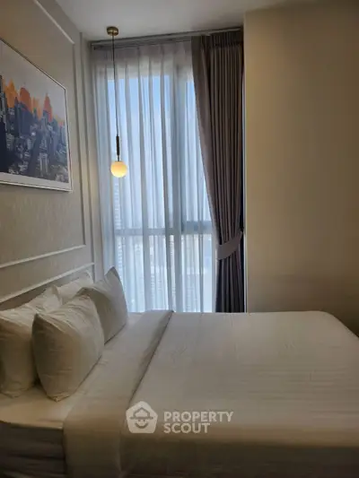 Modern bedroom with large window and stylish decor