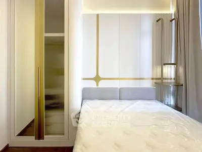 Modern bedroom with sleek design and built-in storage solutions.
