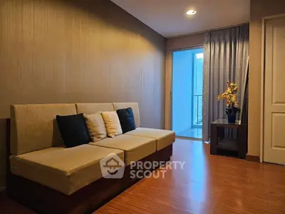 Cozy living room with modern sofa and balcony view