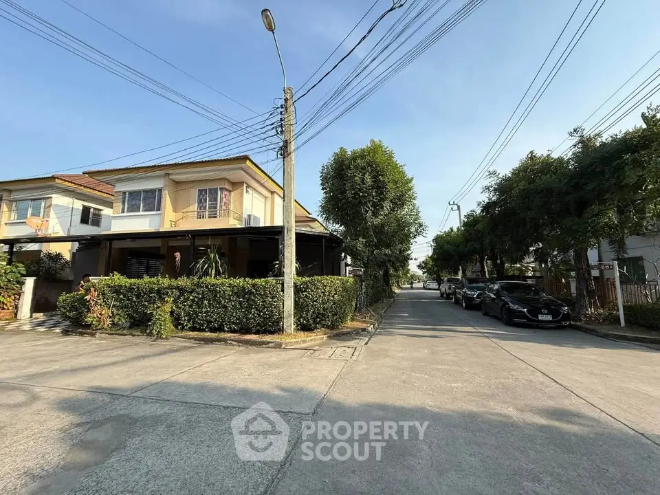Charming suburban house with lush greenery and ample parking space
