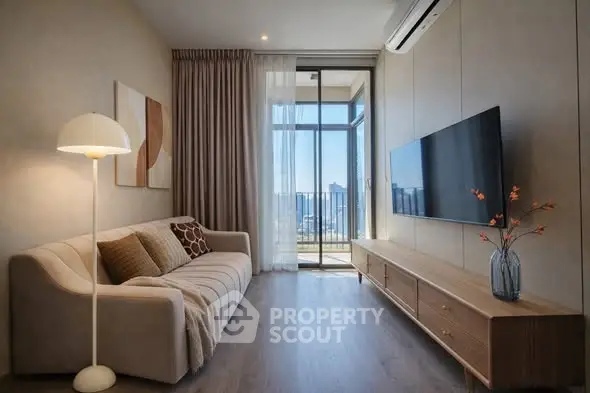 Modern living room with stylish decor and balcony view
