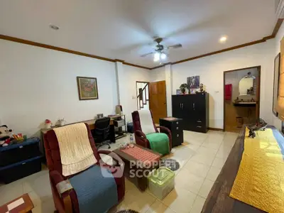 Cozy living room with comfortable seating and modern decor, perfect for relaxation and entertainment.
