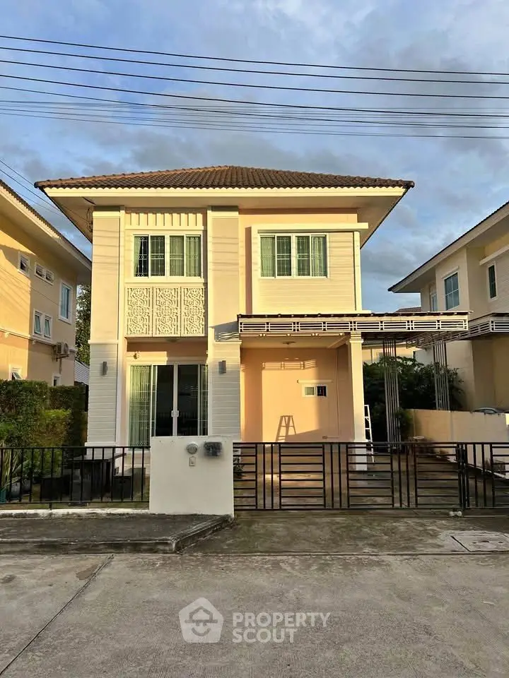 Charming two-story house with modern design and spacious driveway in a serene neighborhood.