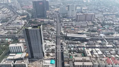 Aerial view of urban cityscape with high-rise buildings and busy streets.