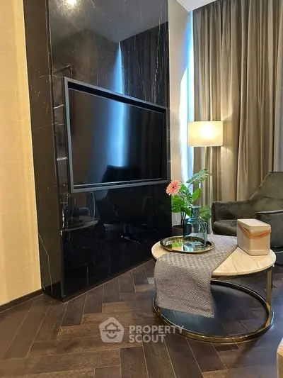 Luxurious living room with sleek TV setup and elegant decor