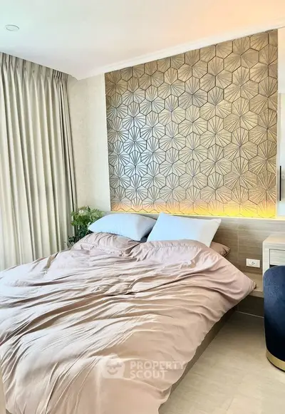 Luxurious bedroom with stylish geometric accent wall and soft lighting