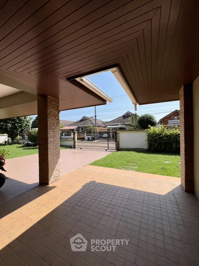 Spacious covered patio with garden view in suburban home