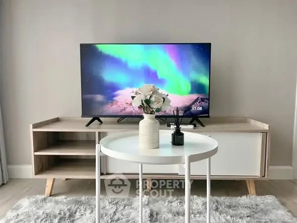 Modern living room with stylish TV stand and cozy decor